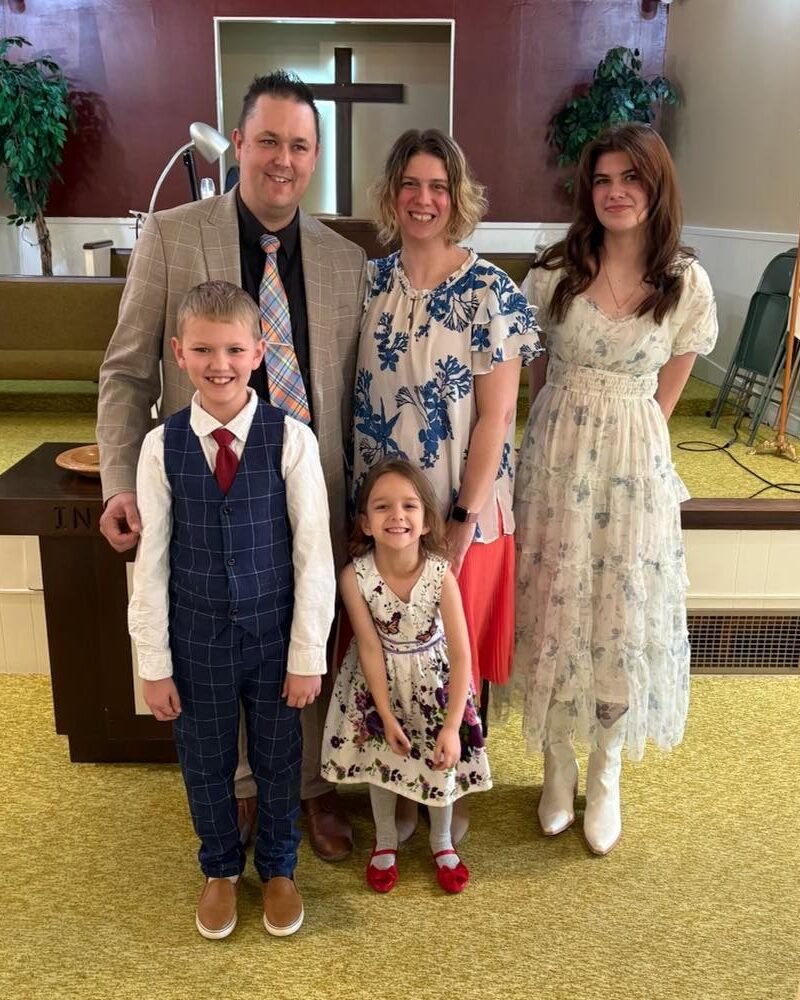 Pastor Jaymeson Ruskamp and his family in the church sanctuary